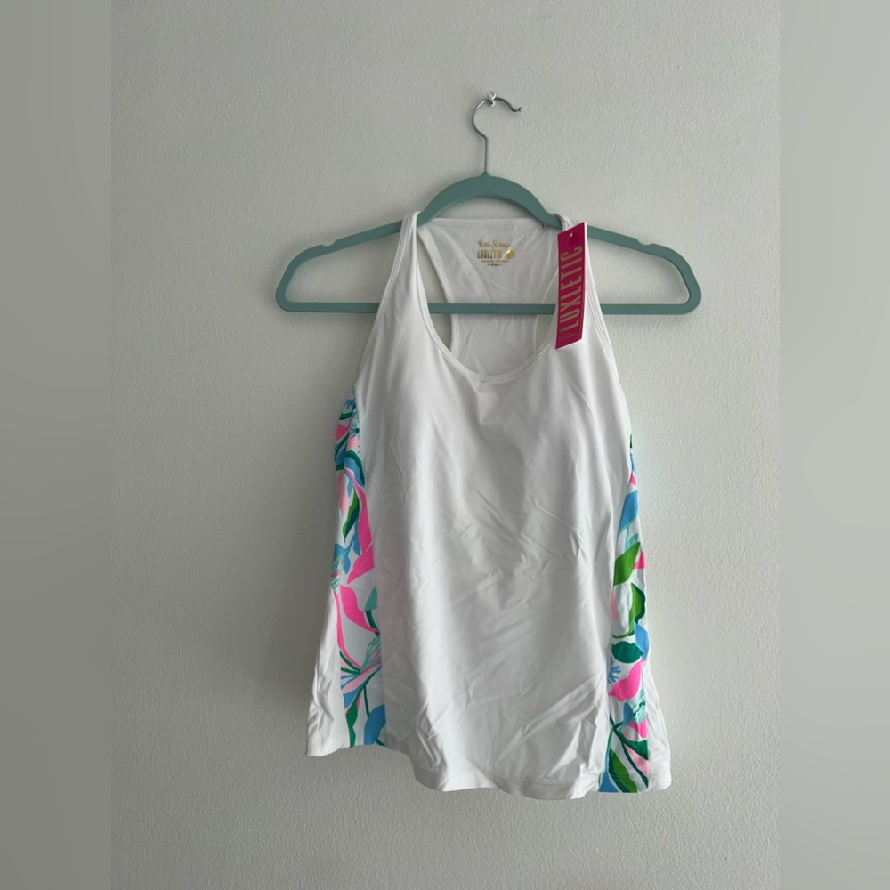 This is a cute white tennis set of Lilly Pulitzer, an american fashion designer